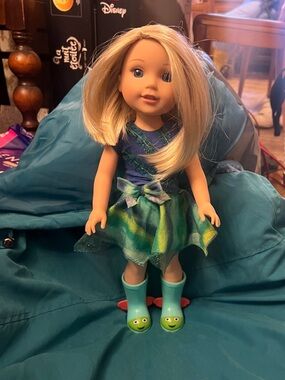 American Girl Blonde Doll in Blue Top and Teal-Green Skirt with Teal Frog Boots